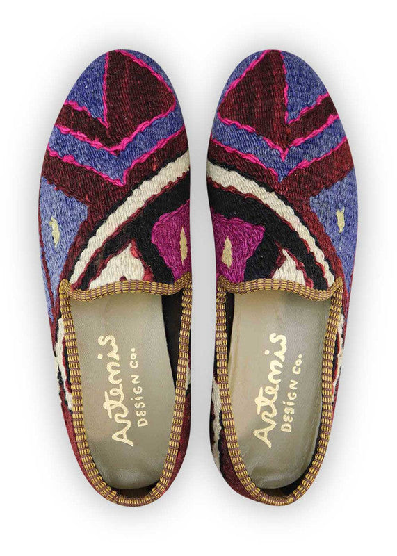 The Artemis Men's Loafers boast a captivating array of colors, featuring blue, red, purple, white, black, and maroon. These loafers seamlessly blend the timeless appeal of blue and black with the boldness of red and maroon, complemented by the regal charm of purple and the classic touch of white. The result is a harmonious and versatile color combination that exudes both confidence and modern style. (Front View)