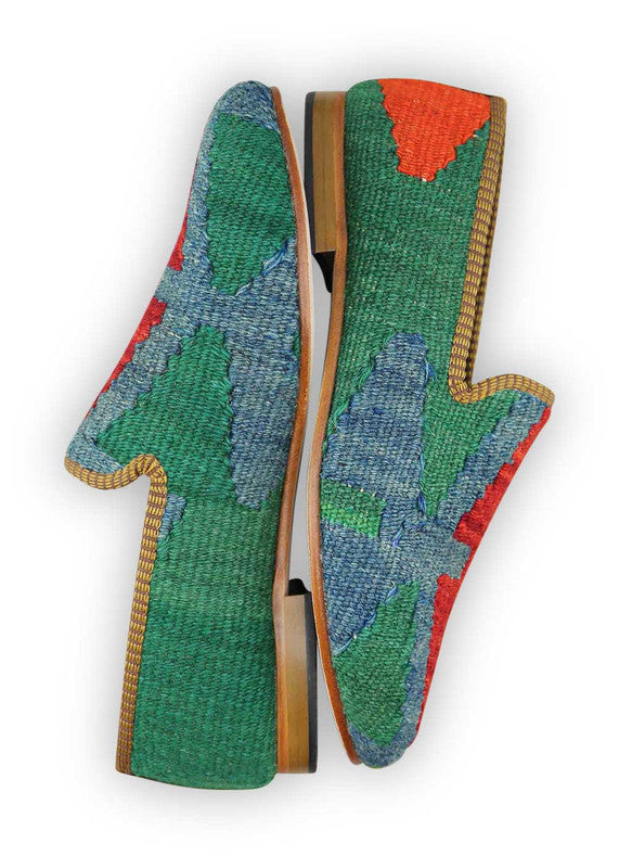 The Artemis Men's Loafers emanate a vibrant blend of colors, featuring green, blue, orange, and red. These loafers seamlessly merge the calming shades of green and blue with the energetic bursts of orange and red, creating a harmonious and dynamic color combination. (Side View)