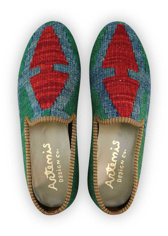 The Artemis Men's Loafers emanate a vibrant blend of colors, featuring green, blue, orange, and red. These loafers seamlessly merge the calming shades of green and blue with the energetic bursts of orange and red, creating a harmonious and dynamic color combination. (Front View)