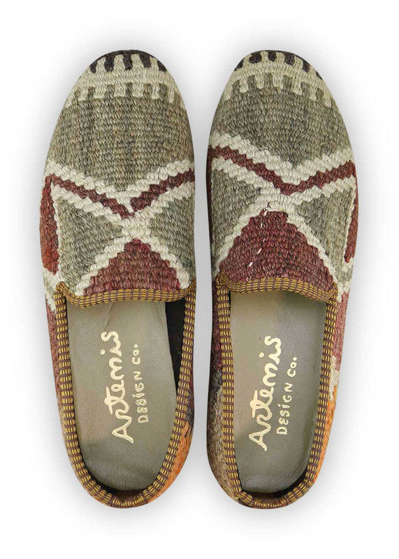 The Artemis Men's Loafers exude understated elegance with a color combination that harmonizes grey, white, dark grey, rust, and brown. These loafers seamlessly blend the neutral charm of grey and white with the richness of rust and brown, accentuated by the depth of dark grey. (Front View)