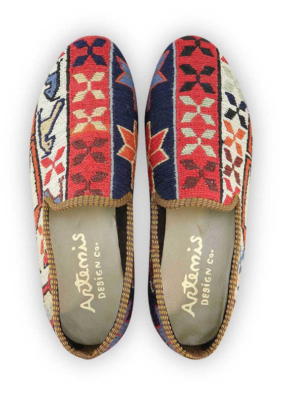 The Artemis Men's Loafers offer a captivating spectrum of colors, featuring red, navy blue, blue, red-orange, white, orange, brown, and grey. These loafers seamlessly blend the boldness of red, navy blue, and red-orange with the classic appeal of blue and white, complemented by the warmth of brown and orange, against the backdrop of neutral grey.  (Front View)