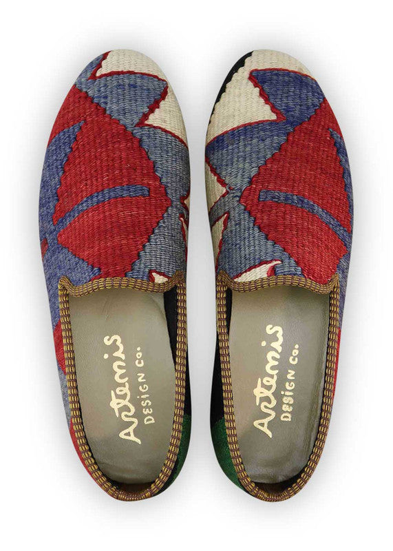 The Artemis Men's Loafers emanate a vibrant blend of colors, featuring white, blue, red, black, and green. These loafers seamlessly combine the fresh appeal of white and blue with the energetic bursts of red and green, balanced by the classic charm of black. The result is a harmonious and versatile color combination that exudes both confidence and modern style. (Front View)