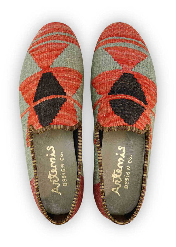 The Artemis Men's Loafers showcase a stylish blend of colors, featuring grey, red, red-orange, and black. These loafers seamlessly blend the understated tones of grey with the boldness of red and red-orange, complemented by the classic appeal of black. The result is a harmonious and versatile color combination that exudes both confidence and modern style. (Front View)