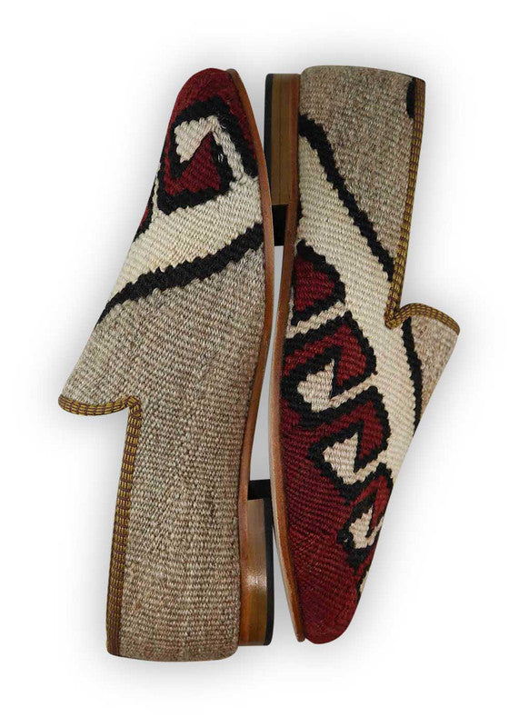 The Artemis Men's Loafers offer a refined palette of colors, featuring grey, white, black, and maroon. These loafers artfully combine the neutral tones of grey and white with the classic appeal of black, enriched by the deep richness of maroon. The result is a balanced and versatile color combination that exudes both sophistication and modern style. (Side View)