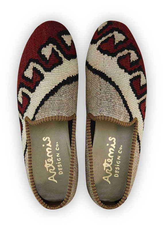 The Artemis Men's Loafers offer a refined palette of colors, featuring grey, white, black, and maroon. These loafers artfully combine the neutral tones of grey and white with the classic appeal of black, enriched by the deep richness of maroon. The result is a balanced and versatile color combination that exudes both sophistication and modern style. (Front View)