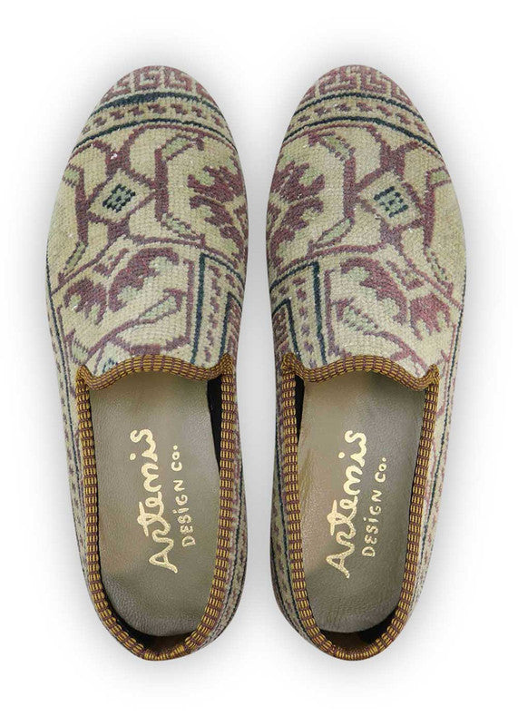 The Artemis Men's Loafers radiate versatile charm with a captivating color palette of khaki, brown, red, white, blue, and green. These loafers seamlessly merge the natural tones of khaki and brown with the boldness of red and blue, complemented by the classic appeal of white and the freshness of green. (Front View)