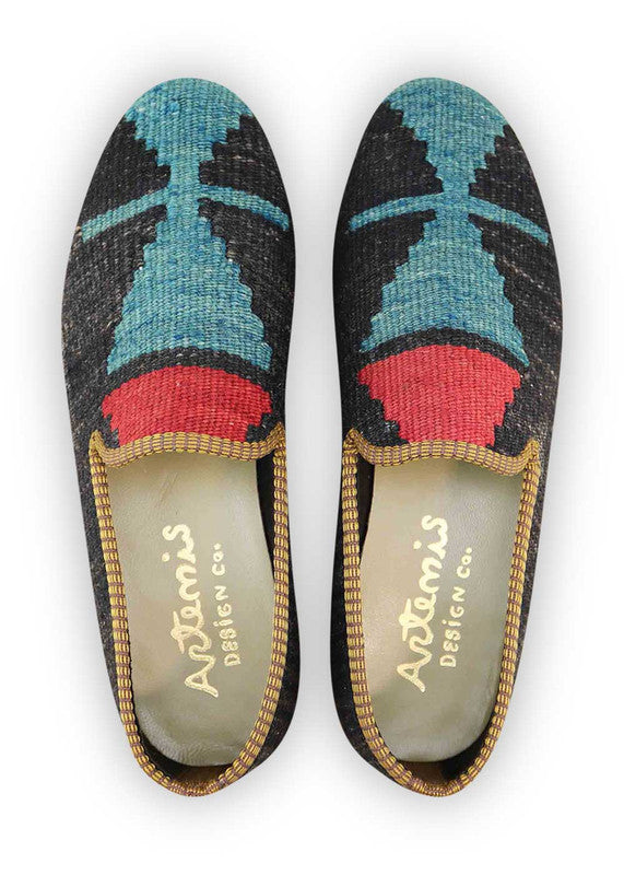 The Artemis Men's Loafers offer a striking contrast of colors, featuring dark grey, sky blue, and red. These loafers seamlessly blend the understated tones of dark grey with the calming hues of sky blue, accented by the boldness of red. The result is a captivating and dynamic color combination that exudes both confidence and modern flair. (Front View)
