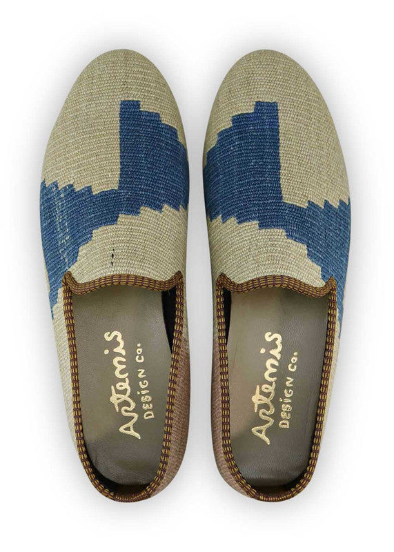The Artemis Men's Loafers exude refined elegance with a color combination that harmoniously blends grey, blue, and khaki. These loafers seamlessly merge the calming tones of grey and blue with the neutral charm of khaki. The result is a balanced and sophisticated color palette that exudes both confidence and modern style. (Front View)