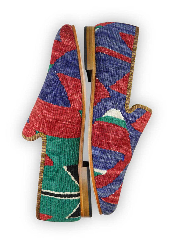 The Artemis Men's Loafers showcase a sleek blend of colors, featuring red, blue, green, white, and black. These loafers effortlessly blend the vibrant energy of red, blue, and green with the classic appeal of white and black. The result is a balanced and versatile color combination that exudes both confidence and modern style. (Side View)