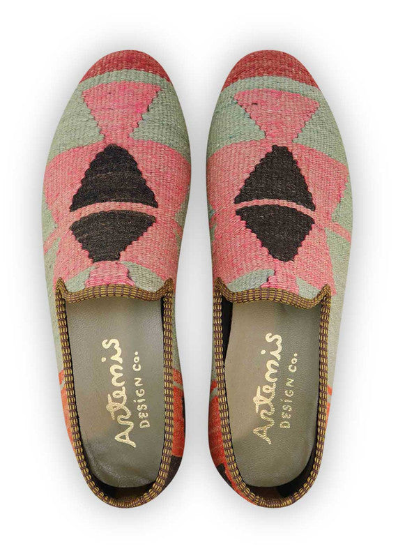 The Artemis Men's Loafers offer a vibrant tapestry of colors, including black, red, white, green, sky blue, orange, yellow, grey, and teal. These loafers seamlessly merge the classic allure of black and white with the energetic bursts of red, green, sky blue, orange, and yellow, complemented by the neutral tones of grey and the serene touch of teal.  (Front View)