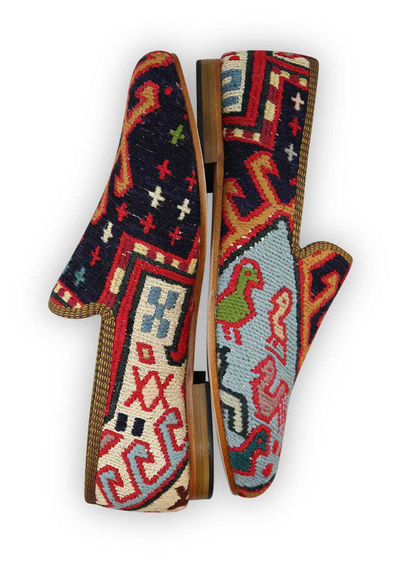 The Artemis Men's Loafers offer a vibrant tapestry of colors, including black, red, white, green, sky blue, orange, yellow, grey, and teal. These loafers seamlessly merge the classic allure of black and white with the energetic bursts of red, green, sky blue, orange, and yellow, complemented by the neutral tones of grey and the serene touch of teal. (Side View)