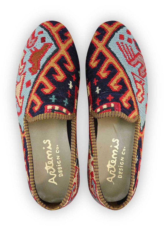 The Artemis Men's Loafers offer a vibrant tapestry of colors, including black, red, white, green, sky blue, orange, yellow, grey, and teal. These loafers seamlessly merge the classic allure of black and white with the energetic bursts of red, green, sky blue, orange, and yellow, complemented by the neutral tones of grey and the serene touch of teal. (Front View)