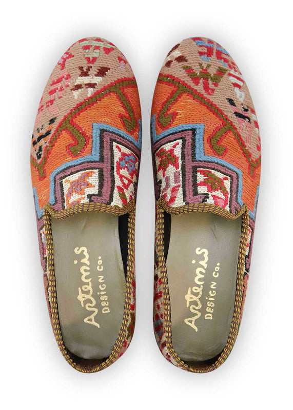 The Artemis Men's Loafers exude a dynamic burst of colors, featuring orange, white, red, sky blue, beige, purple, and green. These loafers seamlessly blend the vibrancy of orange and red with the fresh appeal of white and sky blue, softened by the neutral tones of beige and balanced by the rich depth of purple and the vibrancy of green. (Front View)