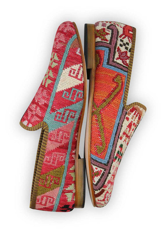 The Artemis Men's Loafers redefine style with a captivating color palette, combining red, blue, red-orange, sky blue, white, and khaki. These loafers seamlessly blend the boldness of red and blue with the lively hues of red-orange and sky blue, set against a clean white backdrop and complemented by the neutral tone of khaki.  (Side View)