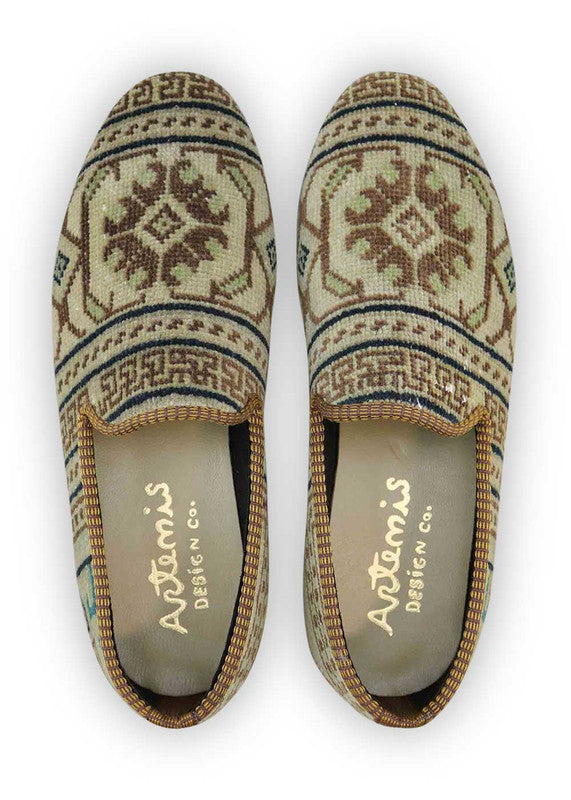 The Artemis Men's Loafers blend a palette of earthy elegance, featuring tones of brown, beige, khaki, white, blue, and peach. These loafers seamlessly combine the warmth of brown and beige with the lightness of khaki and white, enhanced by subtle touches of calming blue and soft peach. (Front View)