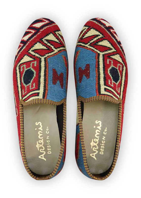 The Artemis Men's Loafers present a stylish mix of colors, featuring red, navy blue, white, grey, sky blue, and maroon. These loafers artfully combine the vibrancy of red and navy blue with the freshness of white and sky blue, complemented by the neutral tones of grey and the rich depth of maroon.  (Front View)