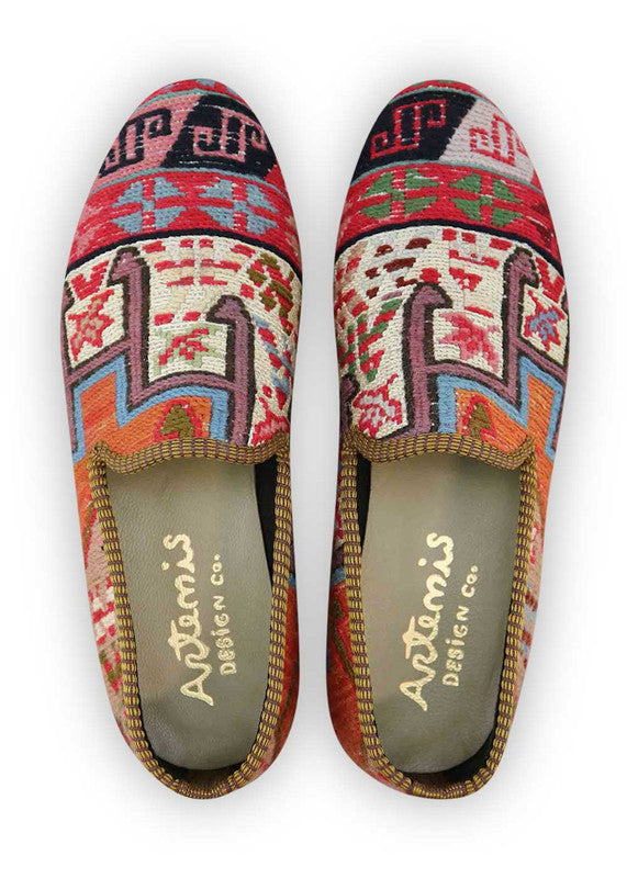 The Artemis Men's Loafers showcase an eclectic mix of colors, including black, khaki, orange, sky blue, lilac, and white-red. These loafers artfully blend the classic allure of black and khaki with vibrant bursts of orange and sky blue, softened by delicate lilac and the dynamic combination of white and red. (Front View)