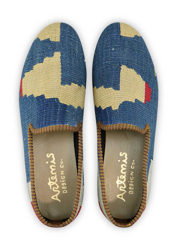Artemis Design & Co Men's Loafers offer a classic and sophisticated choice with a color combination of blue, cream, red, and grey. These loafers are meticulously crafted, often featuring handwoven kilim textiles in these timeless and versatile shades. (Front View)