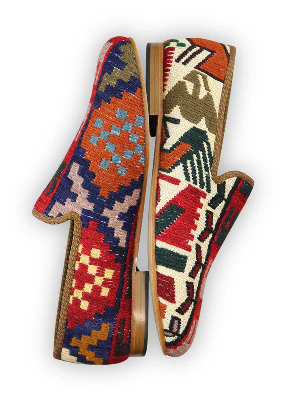 Artemis Design Co. Men's Loafers offer a bold and eclectic color palette, featuring hues of red, pink, blue, brown, orange, sky blue, yellow, and green. Crafted with meticulous attention to detail, these loafers seamlessly blend vibrant colors with timeless style. Perfect for adding a pop of personality to any ensemble, they are suitable for both casual and semi-formal occasions. (Side View)