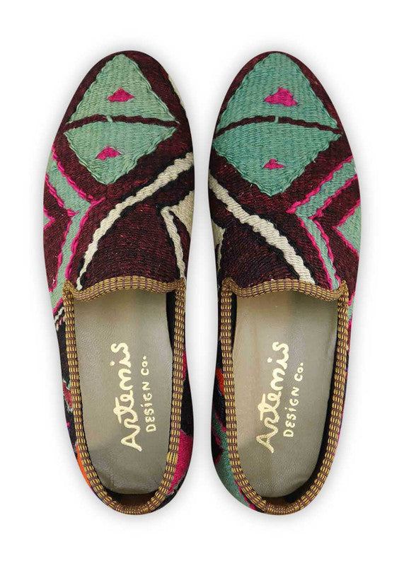 The Artemis Men's Loafers showcase a vibrant medley of colors, including black, orange, blue, fuchsia, green, and white. These loafers skillfully blend the timeless elegance of black with energetic bursts of orange, calming shades of blue, playful fuchsia, fresh green, and crisp white. (Front View)
