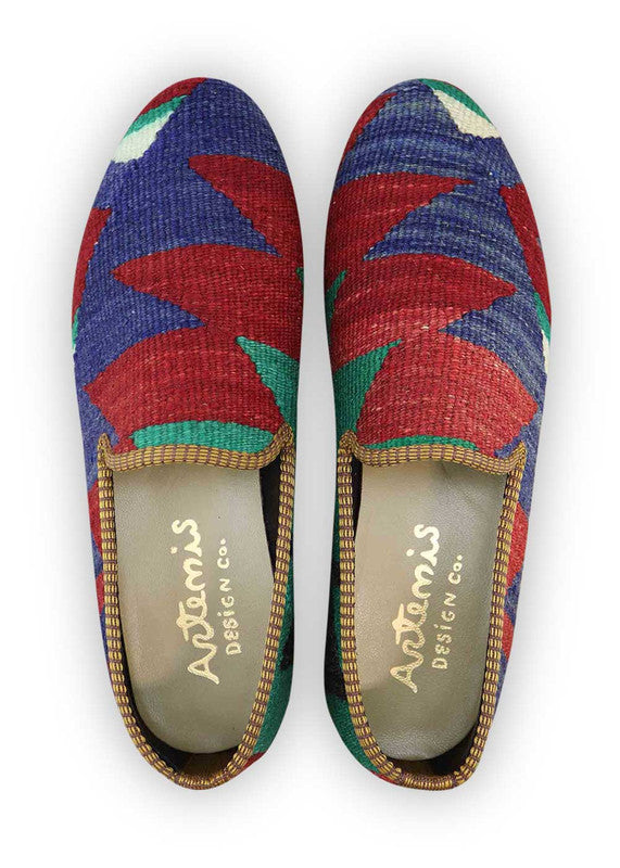 The Artemis Men's Loafers present a tasteful fusion of blue, red, green, and black. These loafers artfully combine rich blue and bold red accents, complemented by subtle touches of vibrant green and timeless black. The result is a harmonious blend of colors that exudes both confidence and style. (Front View)