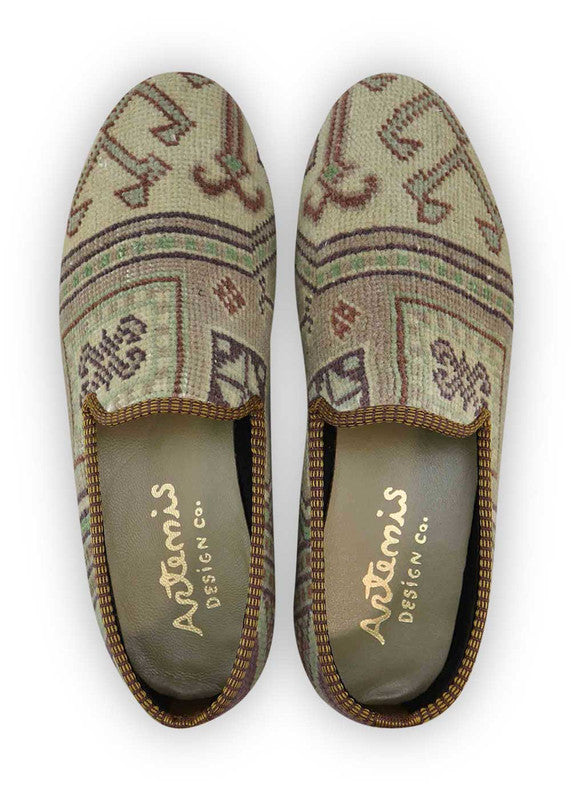 The Artemis Men's Loafers blend a palette of earthy elegance, featuring tones of brown, beige, khaki, white, blue, and peach. These loafers seamlessly combine the warmth of brown and beige with the lightness of khaki and white, enhanced by subtle touches of calming blue and soft peach. (Front View)