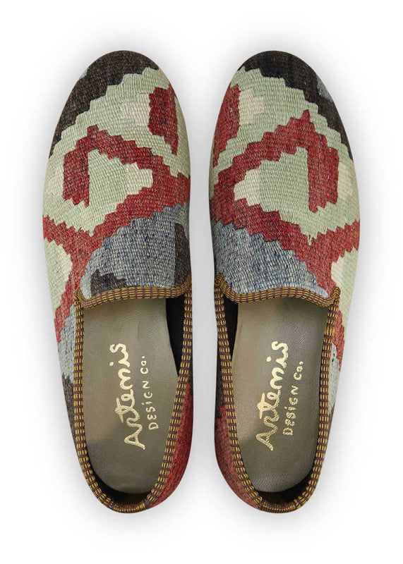 The Artemis Men's Loafers offer a refined color palette featuring black, maroon, blue, and green. These loafers seamlessly merge the timeless elegance of black with the rich depth of maroon, accented by serene shades of blue and lively pops of green. (Front View)