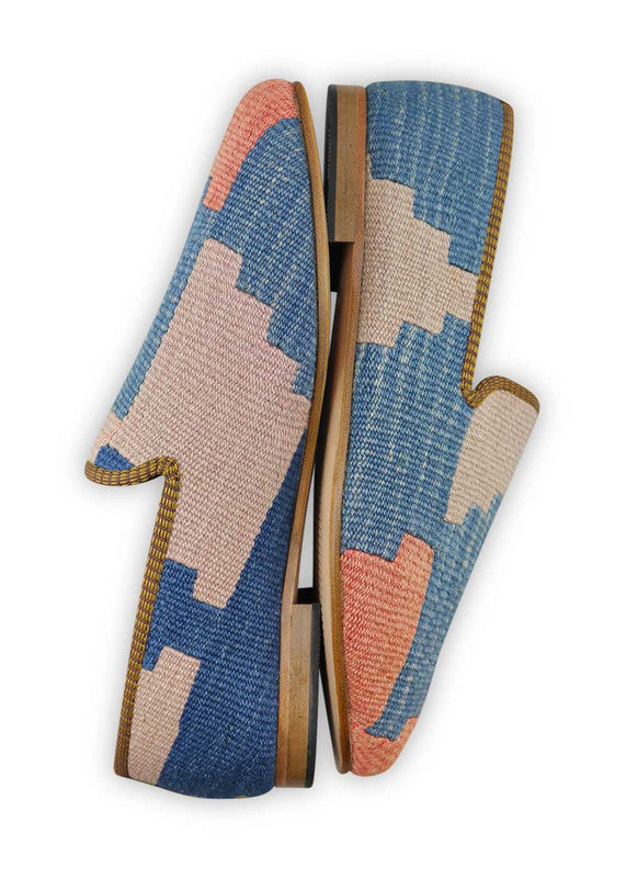 Artemis Design & Co Men's Loafers are a stylish and elegant choice, featuring a refined color combination of blue, peach, sky blue, and grey. These loafers are meticulously crafted, often incorporating handwoven kilim textiles in these serene and complementary shades.  (Side View)