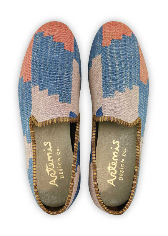 Artemis Design & Co Men's Loafers are a stylish and elegant choice, featuring a refined color combination of blue, peach, sky blue, and grey. These loafers are meticulously crafted, often incorporating handwoven kilim textiles in these serene and complementary shades.  (Front View)
