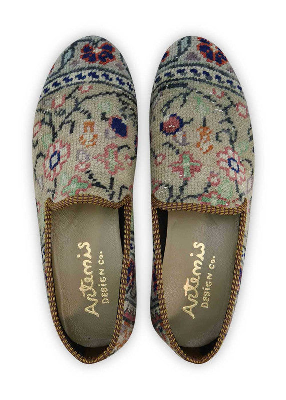The Artemis Men's Loafers blend a palette of earthy elegance, featuring tones of brown, beige, khaki, white, blue, and peach. These loafers seamlessly combine the warmth of brown and beige with the lightness of khaki and white, enhanced by subtle touches of calming blue and soft peach. (Front View)