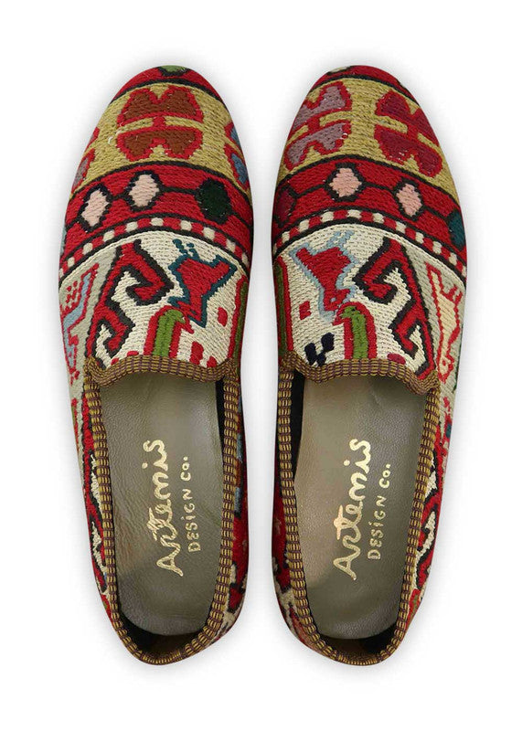 The Artemis Men's Loafers redefine classic style with a captivating blend of red, white, blue, khaki, black, and dark grey. These loafers expertly weave together the boldness of red, the crispness of white, and the depth of blue, enhanced by subtle khaki, timeless black, and sophisticated dark grey accents. (Front View)