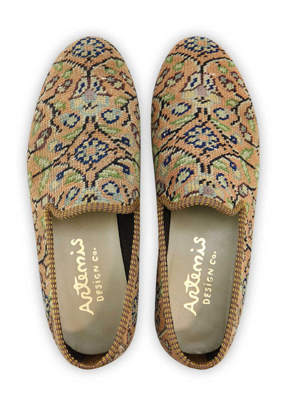 Artemis Design & Co Men's Loafers are a stylish and distinctive footwear choice, featuring an elegant color combination of peach, black, green, blue, white, and grey. These loafers are expertly crafted, often incorporating handwoven kilim textiles in these harmonious yet eye-catching hues.  (Front View)
