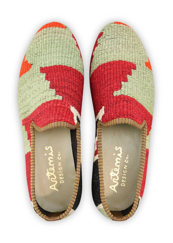 Artemis Design & Co Men's Loafers are a stylish and eye-catching footwear choice, featuring a dynamic color combination of green, grey, red, and black. These loafers are meticulously crafted, often incorporating handwoven kilim textiles in these bold and contrasting hues.  (Front View)