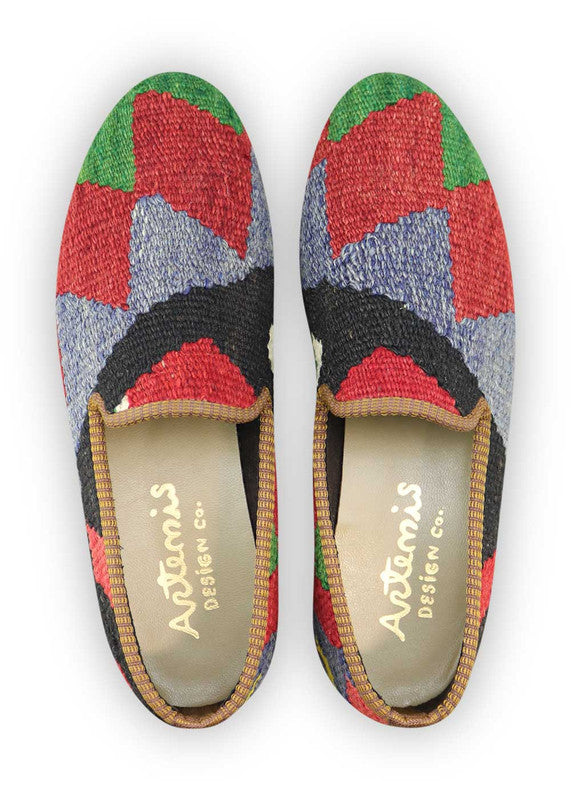 Artemis Design Co. Men's Loafers present a harmonious blend of colors, featuring hues of green, red, blue, black, white, and yellow. Crafted with meticulous attention to detail, these loafers effortlessly combine style with comfort. The vibrant color palette adds a playful yet sophisticated touch to any ensemble, making them a versatile choice for various occasions. (Front View)