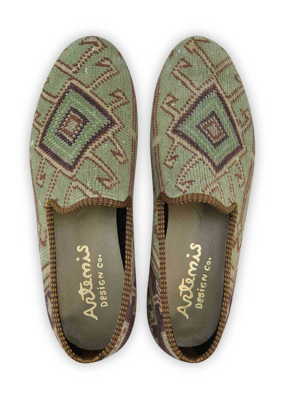 The Artemis Men's Loafers showcase a dynamic color palette that includes khaki,white, green, brown. These loafers expertly blend these diverse hues to create a vibrant and eye-catching design.  (Front View)