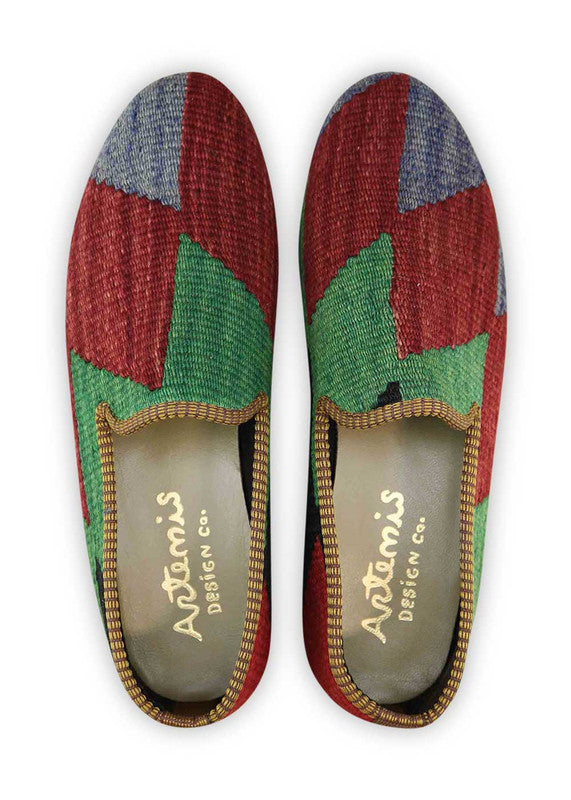 The Artemis Men's Loafers present a tasteful fusion of blue, red, green, and black. These loafers artfully combine rich blue and bold red accents, complemented by subtle touches of vibrant green and timeless black. The result is a harmonious blend of colors that exudes both confidence and style. (Front View)