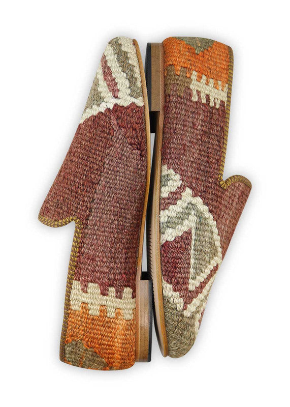 Artemis Design & Co Men's Loafers are a tasteful and versatile footwear choice featuring a color combination of brown, grey, orange, and white. These loafers exemplify exceptional craftsmanship, often incorporating handwoven kilim textiles in these elegant yet understated shades.  ( Side View)
