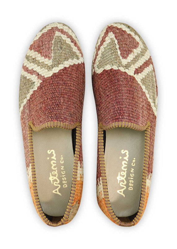 Artemis Design & Co Men's Loafers are a tasteful and versatile footwear choice featuring a color combination of brown, grey, orange, and white. These loafers exemplify exceptional craftsmanship, often incorporating handwoven kilim textiles in these elegant yet understated shades.  (Front View)