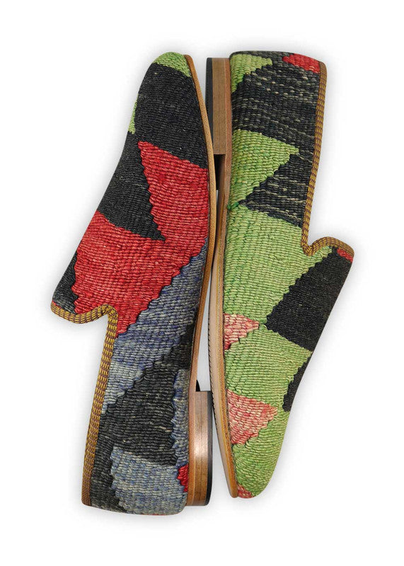 Artemis Design & Co Men's Loafers offer a bold and stylish choice with a color combination of green, black, red, and blue. These loafers showcase meticulous craftsmanship, often featuring handwoven kilim textiles in these striking hues.  (Side View)