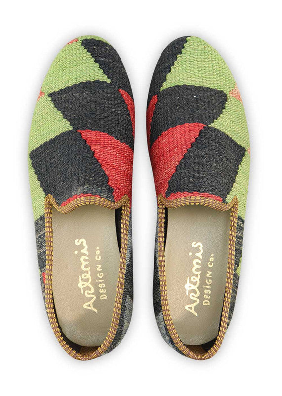 Artemis Design & Co Men's Loafers offer a bold and stylish choice with a color combination of green, black, red, and blue. These loafers showcase meticulous craftsmanship, often featuring handwoven kilim textiles in these striking hues.  (Front View)