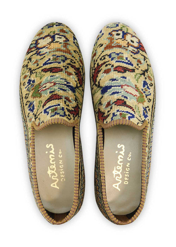Artemis Design & Co Men's Loafers offer a stylish and versatile footwear option with a color combination of khaki, red, grey, blue, green, and peach. These loafers are skillfully crafted, often featuring handwoven kilim textiles in this harmonious palette. (Front View)
