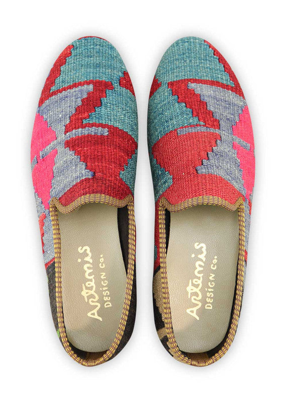Artemis Design & Co Men's Loafers are a vibrant and eye-catching footwear option, featuring a captivating color combination of blue, red, fuchsia, and black. These loafers are meticulously crafted, showcasing handwoven kilim textiles in these striking hues.  (Front  View)