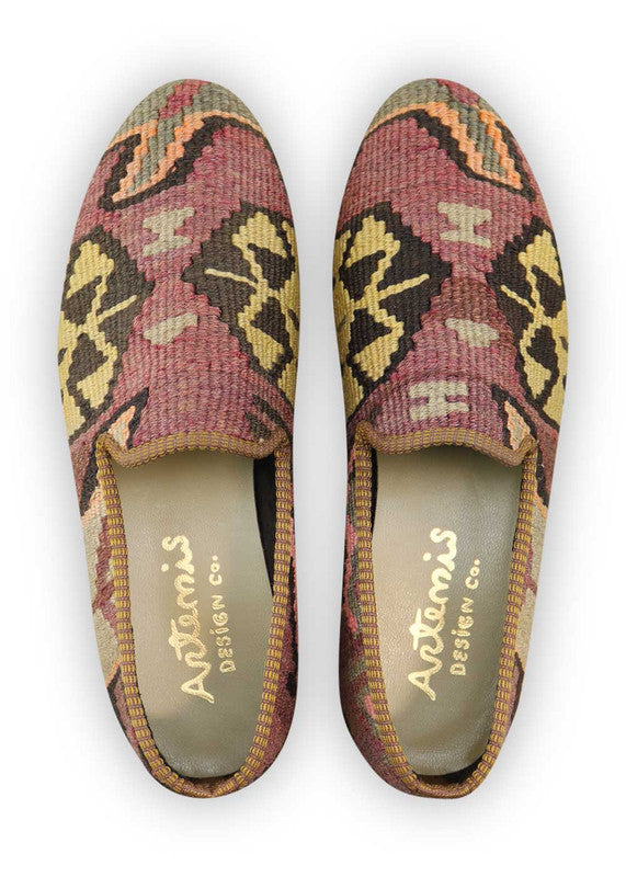 Artemis Design Co. Men's Loafers redefine sophistication with a distinctive color palette featuring shades of grey, purple, black, peach, khaki, and pink. Crafted with precision and style, these loafers offer a contemporary twist on classic footwear. The unique combination of colors adds a pop of personality to any outfit, making a bold statement with every step. (Front View)