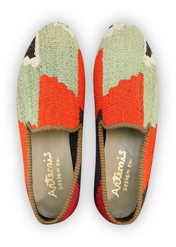 Artemis Design Co. Men's Loafers combine a sleek aesthetic with a dynamic color palette, featuring shades of black, orange, brown, grey, white, and red. These sophisticated loafers exude contemporary style and versatility, perfect for any occasion. Crafted with precision and attention to detail, they offer both comfort and sophistication in every step. Whether paired with casual or formal attire, Artemis Design Co. Men's Loafers are the epitome of refined fashion for the modern gentleman. (Front View)