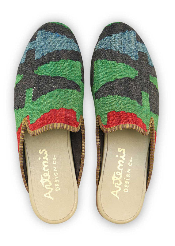 Artemis Design & Co introduces Men's Slippers in a sleek color fusion of blue, white, green, red, and black. Elevate your downtime with these stylish and comfortable slippers, designed for the modern man. The cool tones and bold accents create a contemporary aesthetic, while the meticulous craftsmanship ensures a plush and snug fit. (Front View)