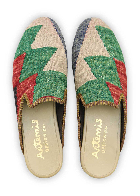 Artemis Design & Co introduces Men's Slippers in a sleek color fusion of blue, white, green, red, and black. Elevate your downtime with these stylish and comfortable slippers, designed for the modern man. The cool tones and bold accents create a contemporary aesthetic, while the meticulous craftsmanship ensures a plush and snug fit. (Front View)