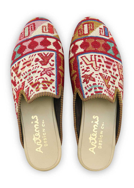 Artemis Design & Co introduces Men's Slippers that embody a vibrant spectrum of colors, including red, white, green, peach, blue, orange, brown, and teal. Elevate your comfort with these stylish and diverse slippers, carefully crafted to bring a touch of flair to your loungewear. (Front View)