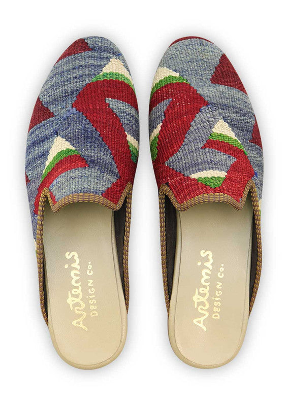 Artemis Design & Co presents Men's Slippers in a captivating color combination of red, green, white, blue, and maroon. These slippers are a fusion of style and comfort, designed to elevate your relaxation experience. (Front View)