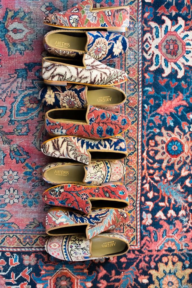 Row of oriental carpet loafers on an oriental carpet
