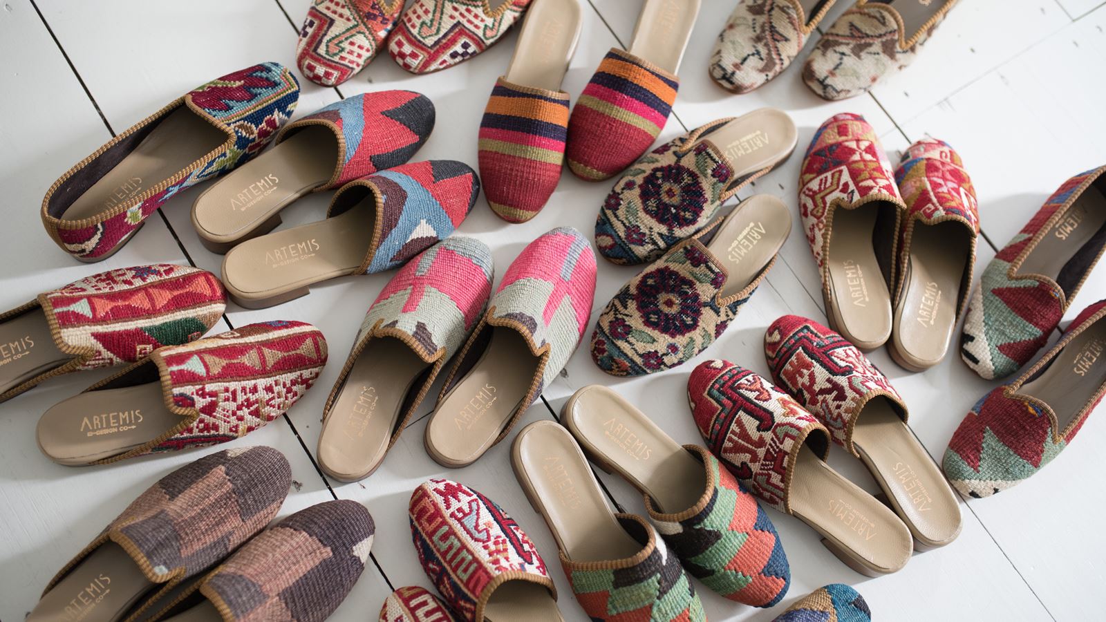 Kilim footwear refers to shoes, sandals, or slippers that are crafted using traditional kilim textiles. Kilim fabrics are typically handwoven and feature intricate patterns and designs, often showcasing vibrant colors and cultural motifs. Kilim footwear combines the comfort and functionality of footwear with the unique and artistic qualities of kilim textiles. These shoes are known for their durability and distinctive style, offering a blend of tradition and contemporary fashion. 